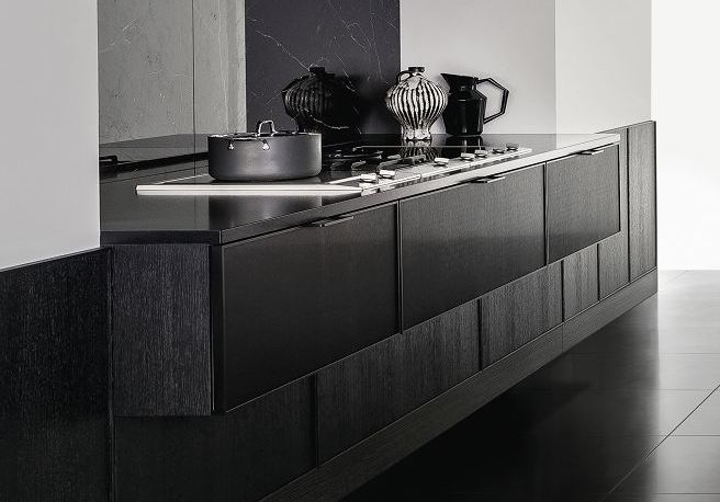 SieMatic Pure SE 3003 R kitchen with brushed metal door fronts and side panels in black matte oak