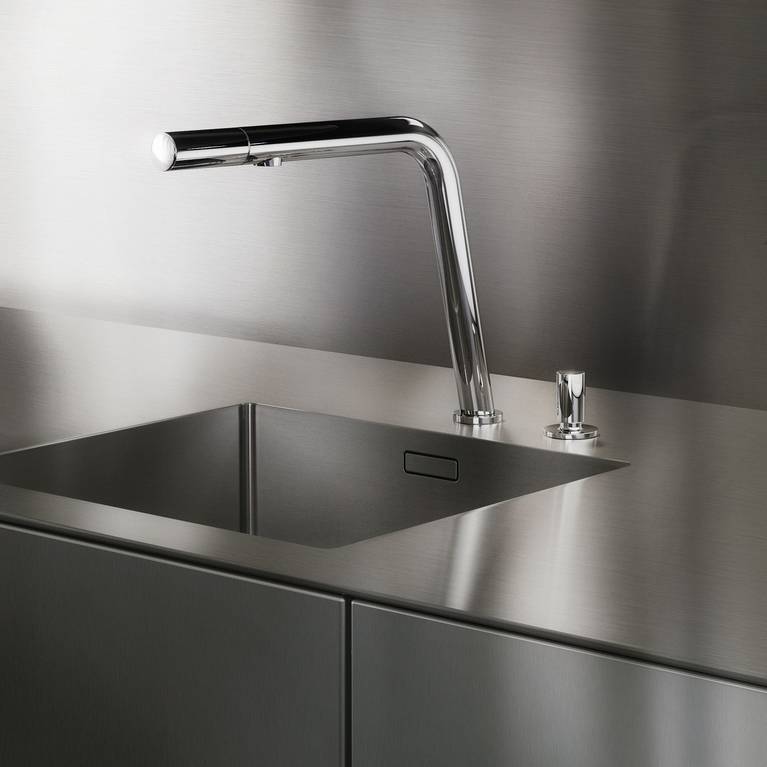 SieMatic Pure SE base cabinets in stainless steel with SieMatic-exclusive faucet with intelligent controls in the faucet head