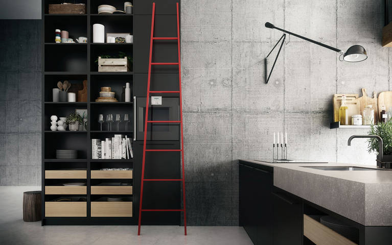 Room-dividing, ceiling-high SieMatic Urban SE shelves in graphite grey with integrated electric appliances to connect kitchen with living areas