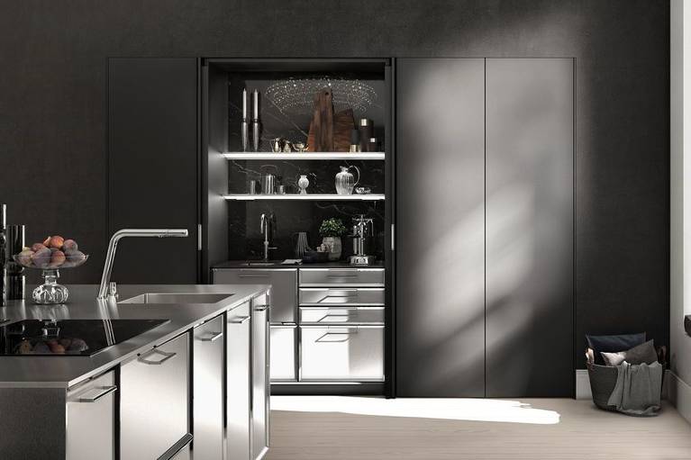 SieMatic Classic BeauxArts SE kitchen island with faceted door fronts and extensive stainless steel