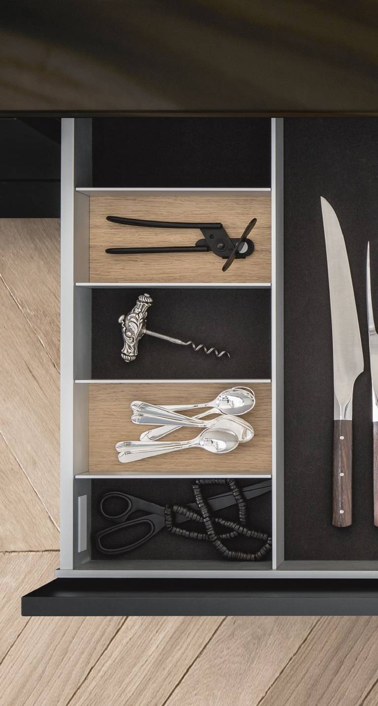 Cutlery and other functional inserts from the SieMatic Aluminum Interior Accessories System
