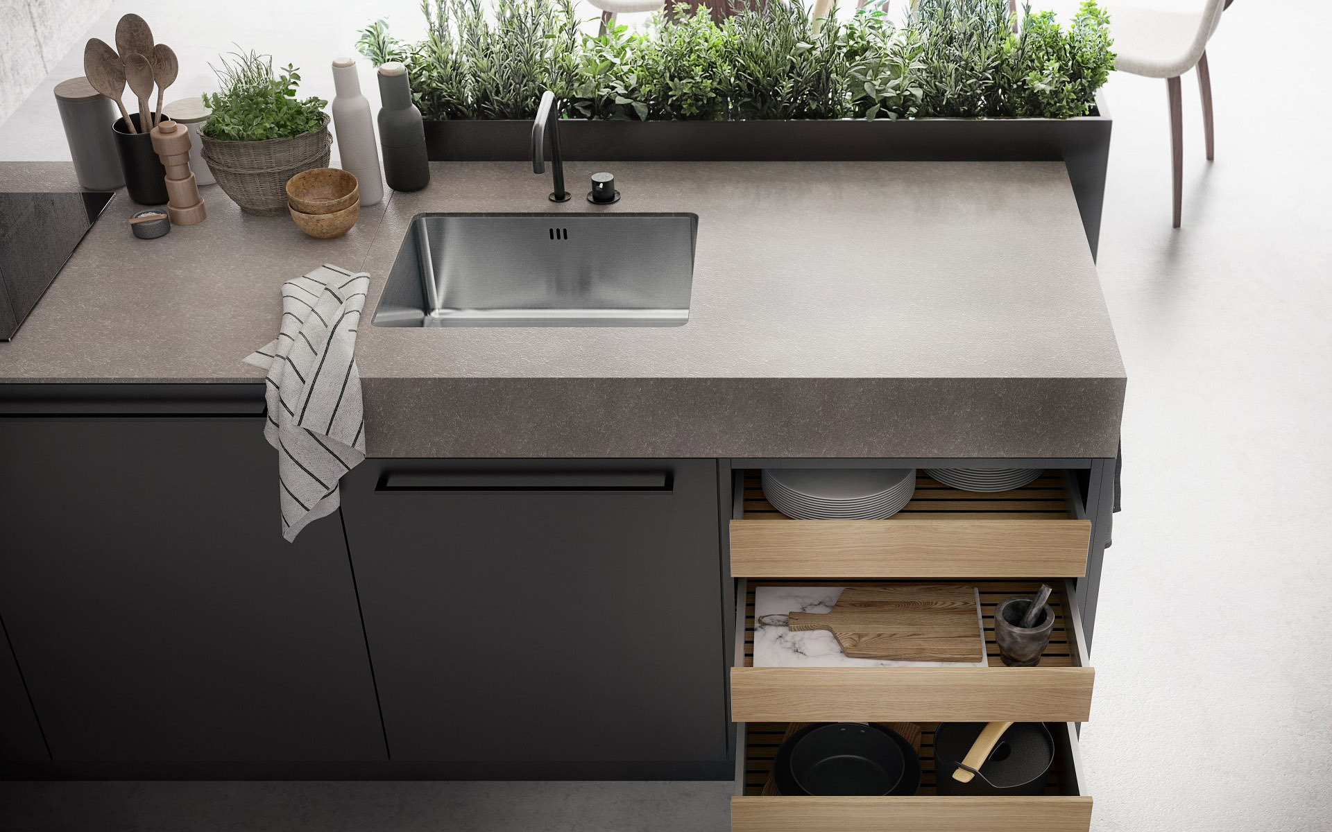 SieMatic Urban SE kitchen island in graphite grey with herb garden and SieMatic StoneDesign countertop