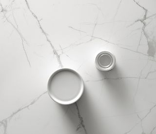 white porcelain jars on white marble countertop